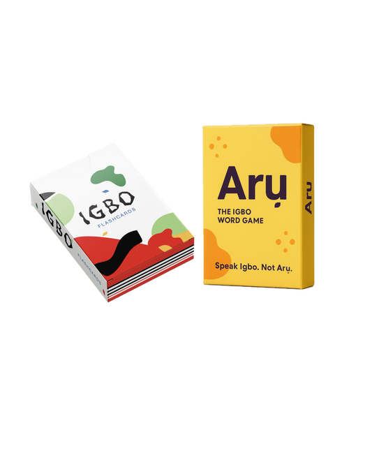 Two boxed word games shown on a plain white background: a white box labeled Igbo with colorful abstract shapes, and a yellow box labeled Arı with the subtitle The Igbo Word Game and the phrase Speak Igbo, Not Aru.